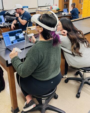 student in class using innovative technology to learn stem topic